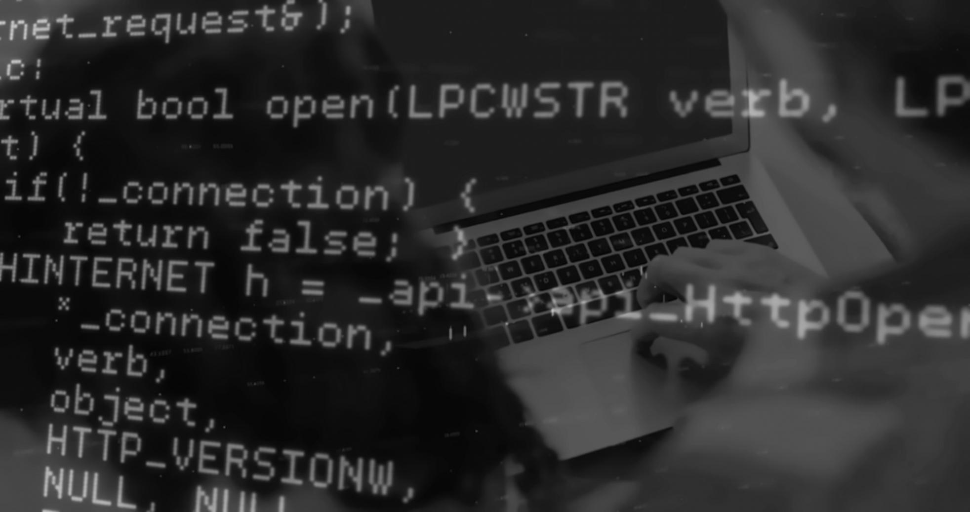 Game development workspace with multiple monitors displaying engine code and performance metrics